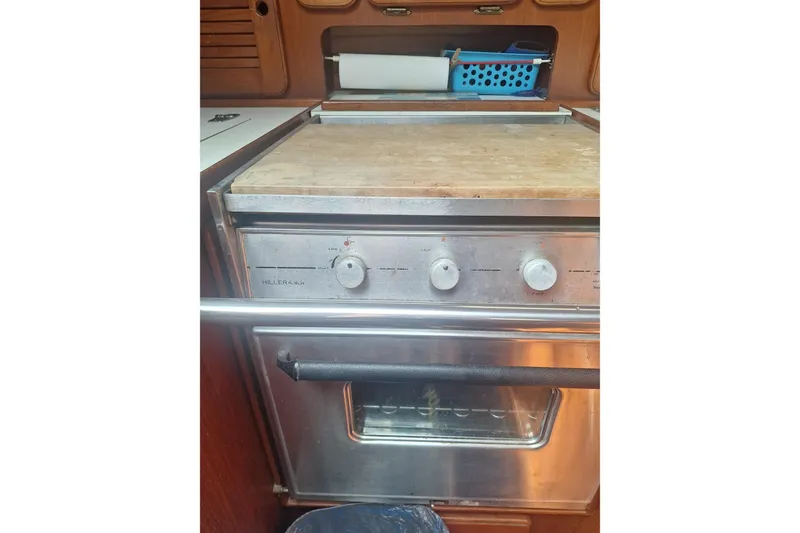 Slide: The Image of Stainless steel oven in a 1987 Morgan 384 yacht kitchen, featuring wooden cabinetry. - 54
