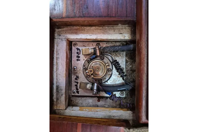 Slide: The Image of 1987 Morgan 384 boat component, showing a fuel system part with hoses and fittings. - 68