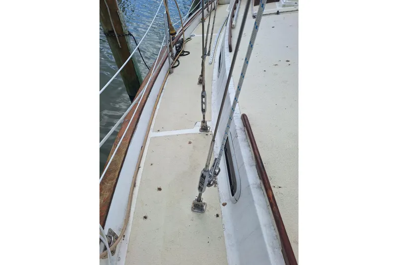 Slide: The Image of Deck view of a 1987 Morgan 384 sailboat, showing rigging and railing details. - 9