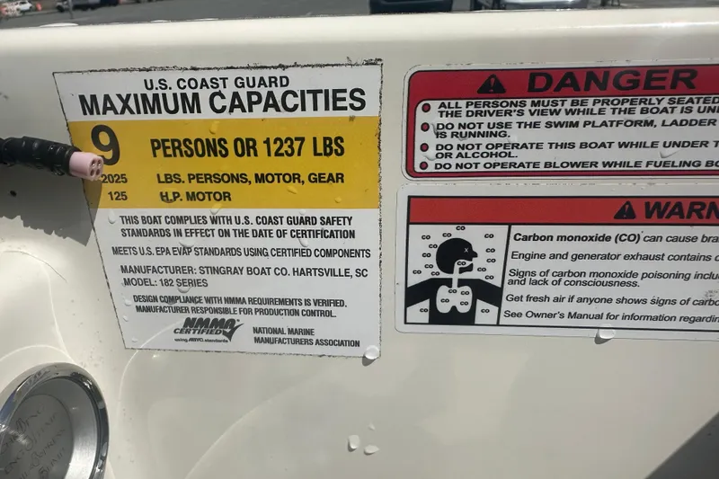 Slide: The Image of 2022 Stingray 182 SC boat capacity and safety warnings, including carbon monoxide precautions. - 13