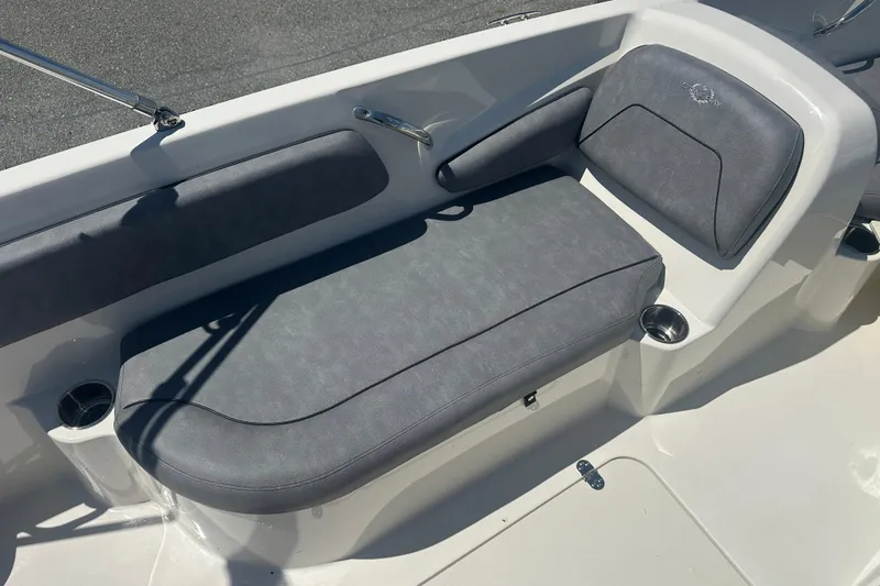 Slide: The Image of 2022 Stingray 182 SC boat interior with gray cushioned seating and cup holders. - 14
