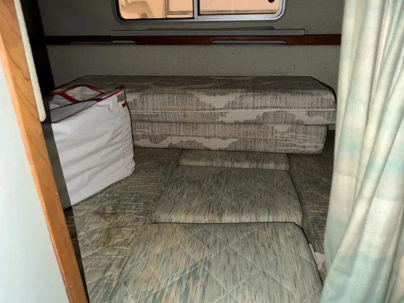 Slide: The Image of Interior of a 1989 Sea Ray 300 Sundancer with upholstery. - 12