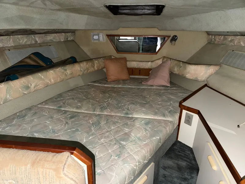 Slide: The Image of 1989 Sea Ray 300 Sundancer interior with sleeping area. - 14