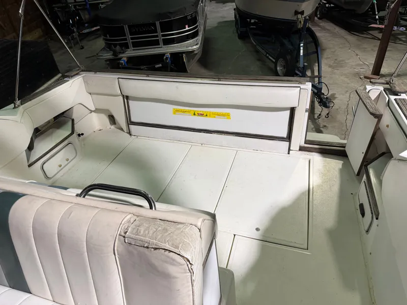 Slide: The Image of Interior of a 1989 Sea Ray 300 Sundancer yacht, white upholstery. - 27