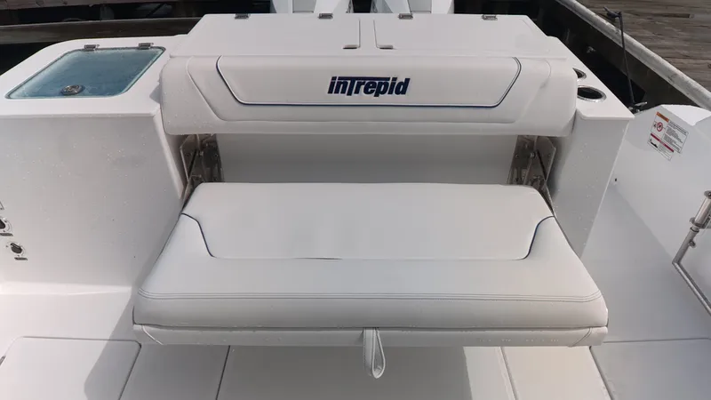 Slide: The Image of The 2027 Intrepid 35 PANACEA features a white, cushioned bench seat in the stern area. - 12