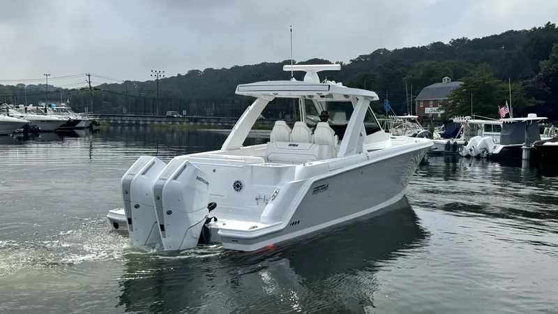 Slide: The Image of Intrepid 35 PANACEA 2027 on calm water with twin outboard engines. - 1
