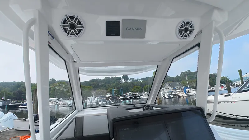 Slide: The Image of Interior view of an Intrepid 35 PANACEA with modern electronics and speakers, docked at a marina. - 27
