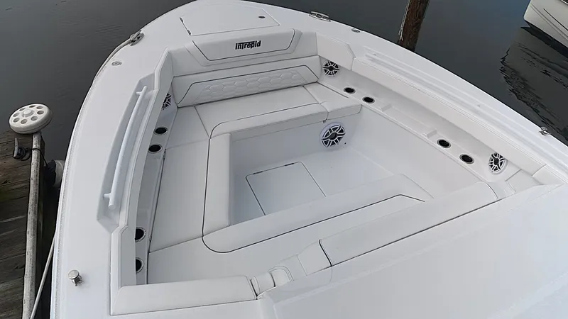 Slide: The Image of The image shows the bow area of a 2027 Intrepid 35 PANACEA boat with white upholstery. - 40