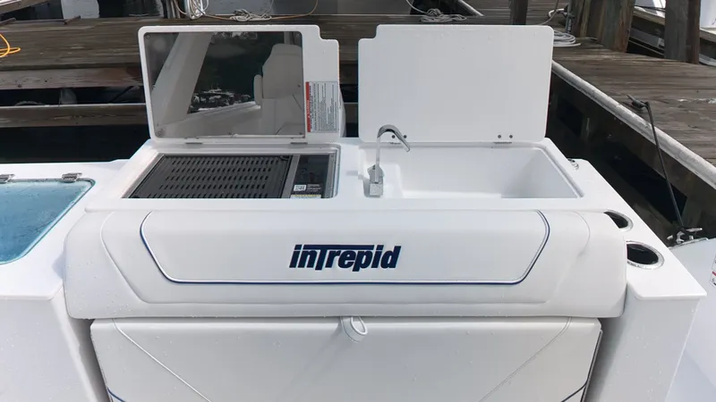 Slide: The Image of The 2027 Intrepid 35 PANACEA features a modern outdoor kitchen with a sink and grill. - 11