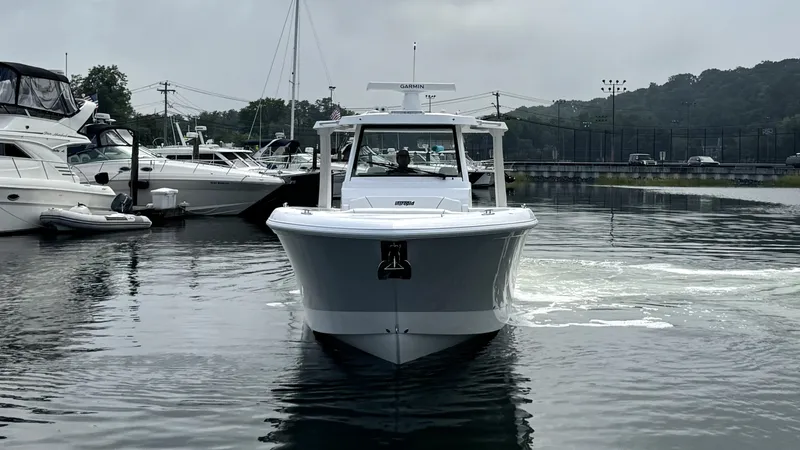 Slide: The Image of Intrepid 35 PANACEA 2027 in a harbor, surrounded by other boats. - 3