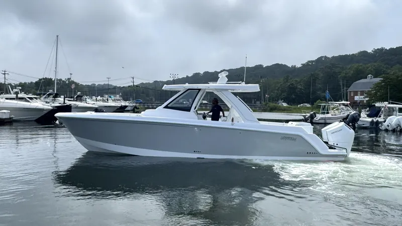 Slide: The Image of A modern Intrepid 35 PANACEA boat from 2027 on calm water. - 49