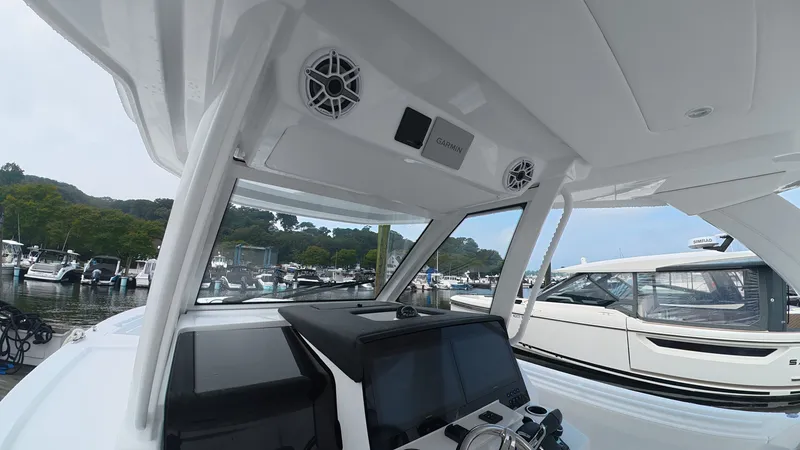 Slide: The Image of The image shows the cockpit of a 2027 Intrepid 35 PANACEA with modern electronics. - 25