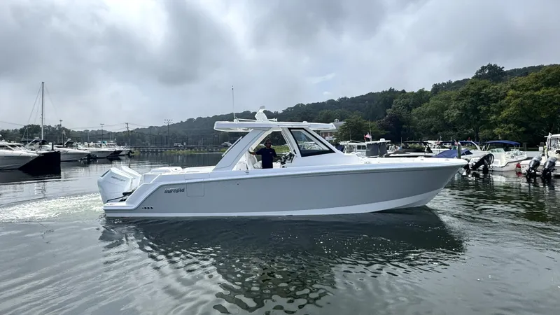 Slide: The Image of A modern Intrepid 35 PANACEA boat from 2027 on calm water. - 0
