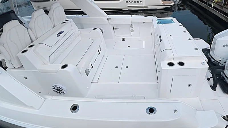 Slide: The Image of The image shows the spacious cockpit of an Intrepid 35 PANACEA with white seating and storage. - 7