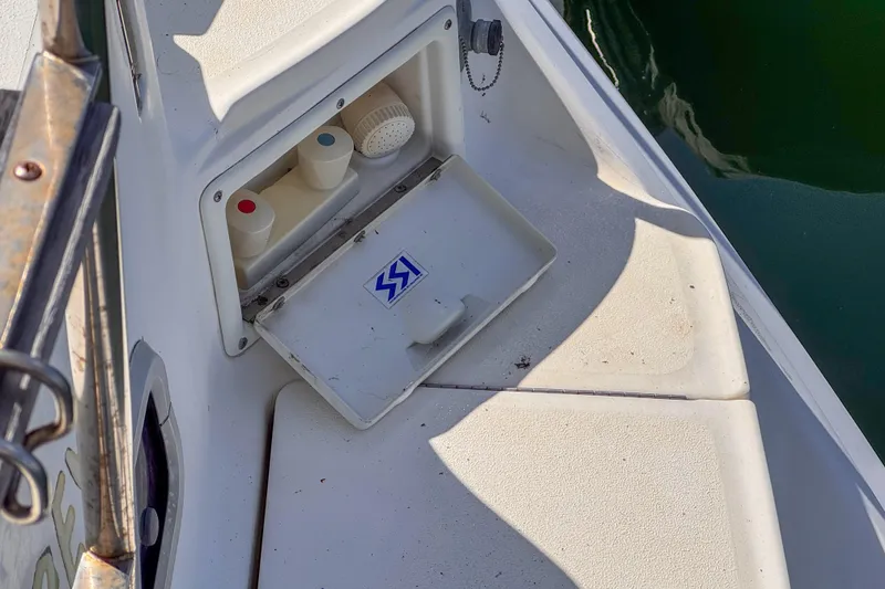 Slide: The Image of Deck compartment of 1997 Hunter Passage 42 sailboat with open storage hatch. - 10