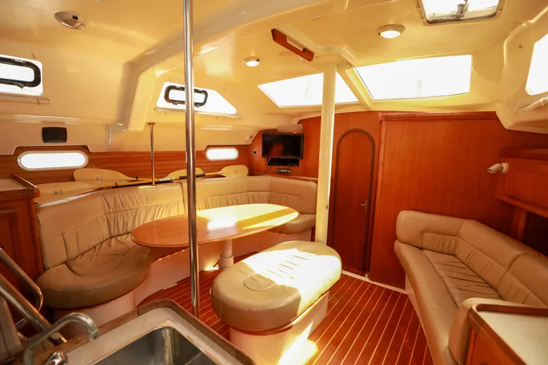 Slide: The Image of Interior of 1997 Hunter Passage 42 yacht with cozy seating and wooden finishes. - 12