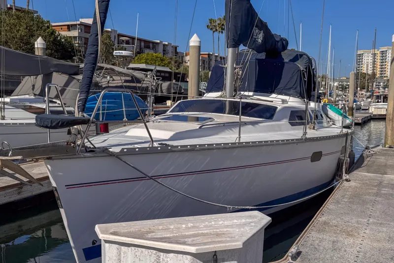 Slide: The Image of Hunter Passage 42 sailboat, 1997 model, docked at a marina under clear blue skies. - 2