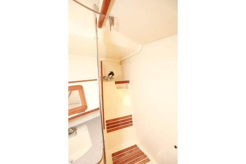 Slide: The Image of Shower area in 1997 Hunter Passage 42 yacht with wooden accents and mirror. - 28