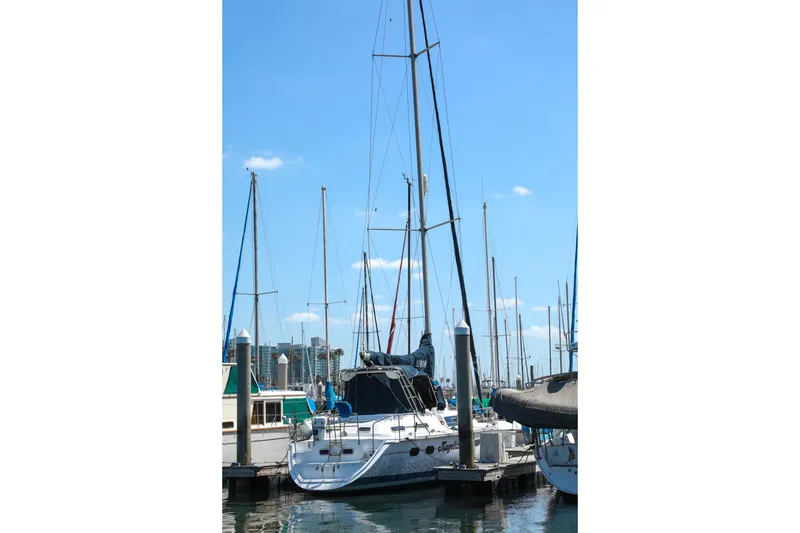 Slide: The Image of Sailboat Hunter Passage 42, 1997 model, docked at marina under clear blue sky. - 3