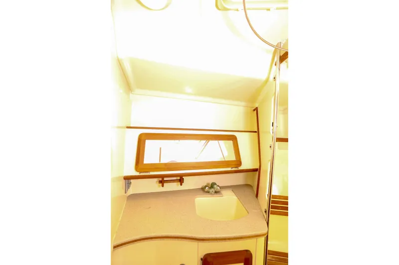 Slide: The Image of Interior of 1997 Hunter Passage 42 sailboat with sink and window. - 33