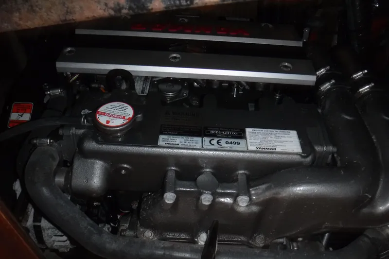 Slide: The Image of Engine of a 1997 Hunter Passage 42 sailboat, featuring Yanmar components. - 34