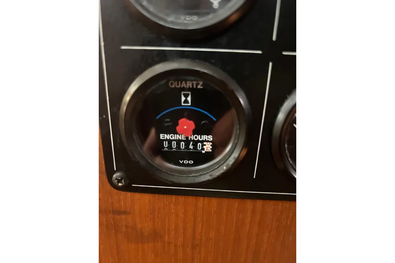 Slide: The Image of Engine hour meter on 1997 Hunter Passage 42 sailboat dashboard. - 42