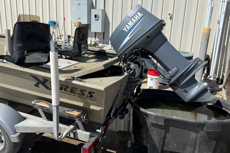 Slide: The Image of 2003 Xpress 1650VJF boat with Yamaha motor in maintenance area. - 3