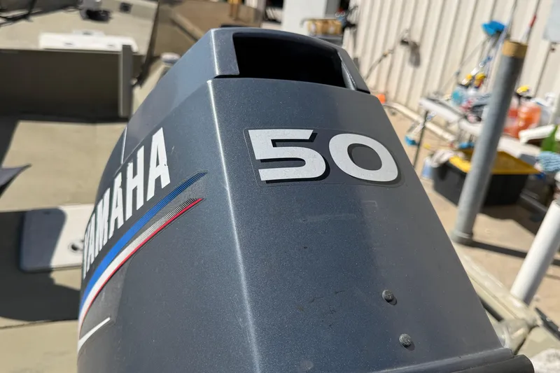 Slide: The Image of Yamaha 50 horsepower outboard motor on a 2003 Xpress 1650VJF boat. - 4