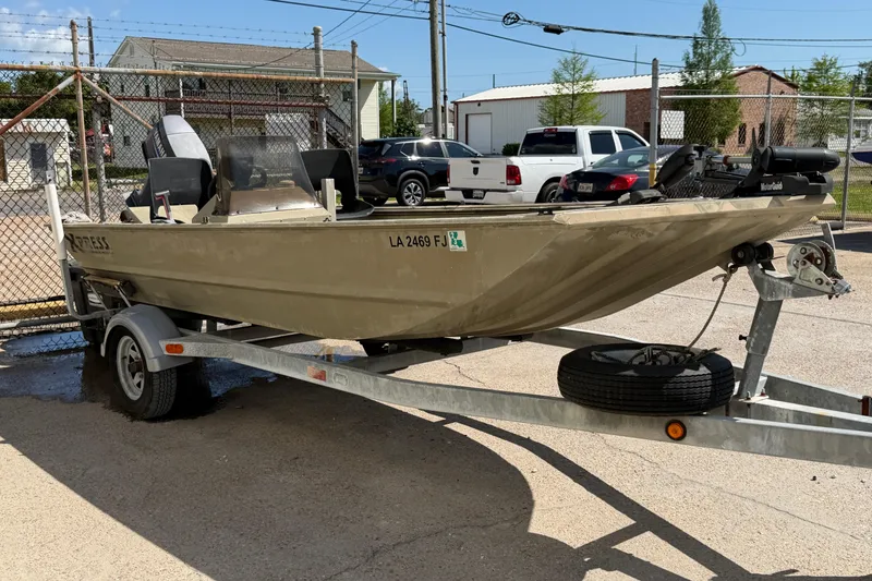 Slide: The Image of 2003 Xpress 1650VJF boat on trailer in parking lot. - 6