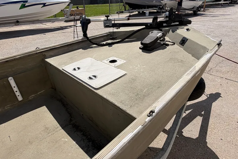 Slide: The Image of 2003 Xpress 1650VJF boat interior with trolling motor and storage compartments. - 7