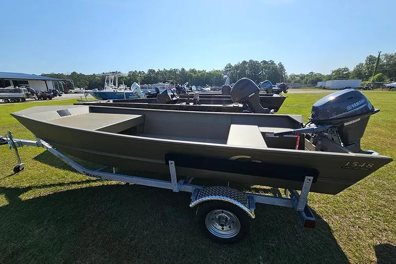 The Image of 2026 G3 Gator Tough 1548 VBW boat on trailer, featuring Yamaha outboard motor. - 2