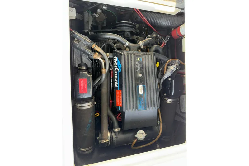 Slide: The Image of Engine compartment of a 1994 Sea Ray 310 Amberjack with MerCruiser components. - 15