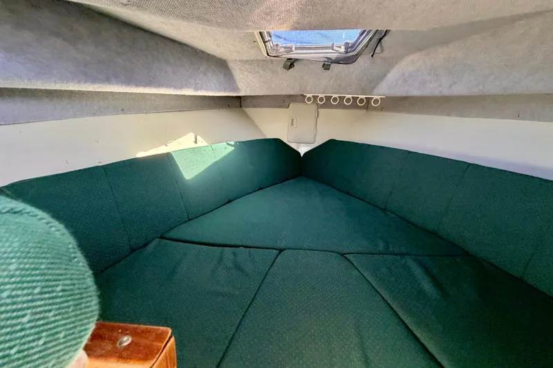 Slide: The Image of Interior cabin of 2001 Skagit Orcas 27XLC boat with green upholstery. - 17