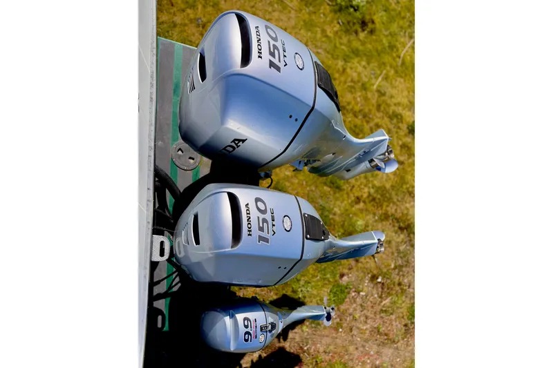 Slide: The Image of Twin Honda outboard motors on a 2001 Skagit Orcas 27XLC boat, viewed from above. - 20