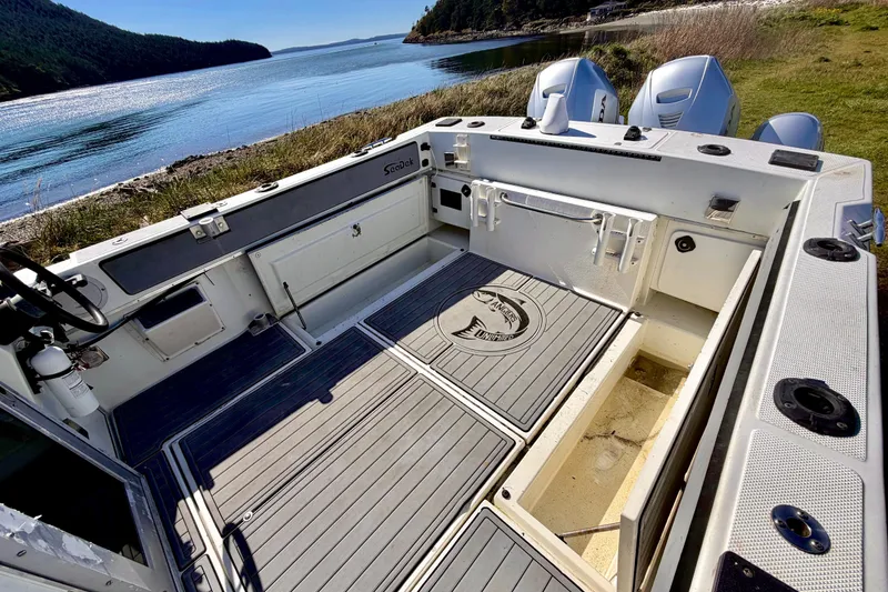 Slide: The Image of 2001 Skagit Orcas 27XLC boat interior with scenic waterfront view. - 6