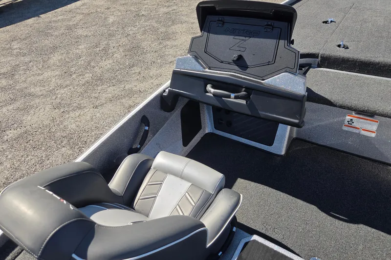 Slide: The Image of 2023 Nitro Z19 boat interior with gray seating and storage compartment. - 11