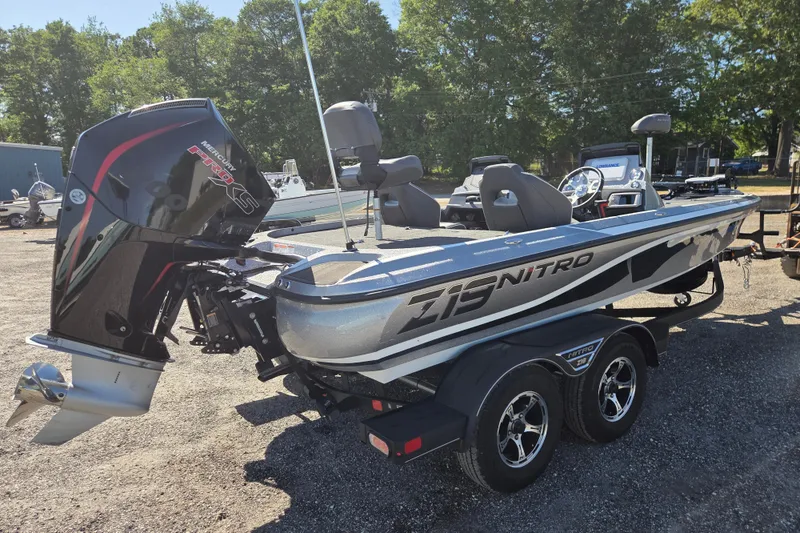 Slide: The Image of 2023 Nitro Z19 boat with Mercury Pro XS engine, parked outdoors. - 3