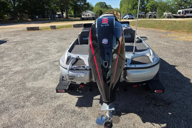 Slide: The Image of 2023 Nitro Z19 boat with powerful outboard motor in a parking area. - 4