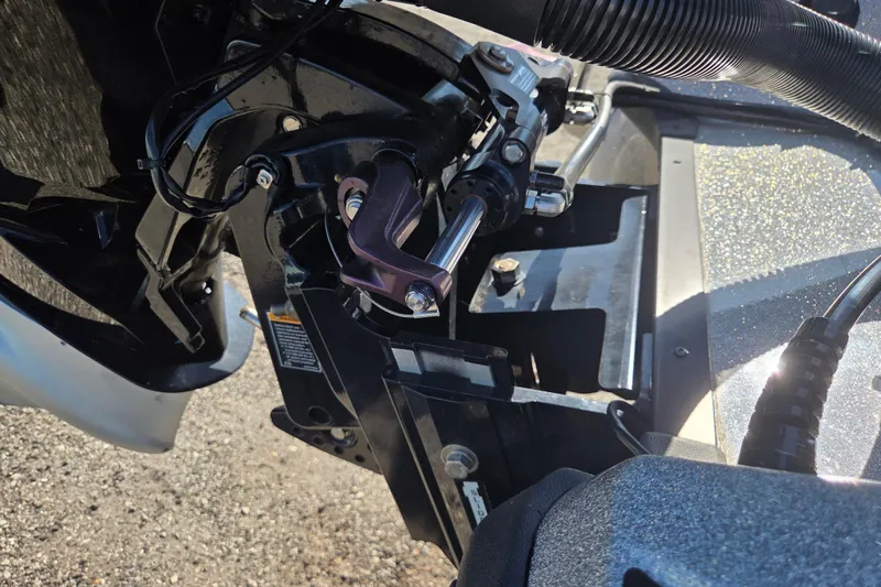 Slide: The Image of Close-up of 2023 Nitro Z19 boat engine components in sunlight. - 8