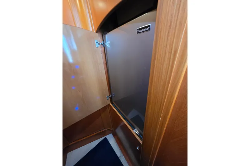 Slide: The Image of Wooden cabinet with Magic Chef appliance on 2000 Sealine T51 MY yacht. - 22