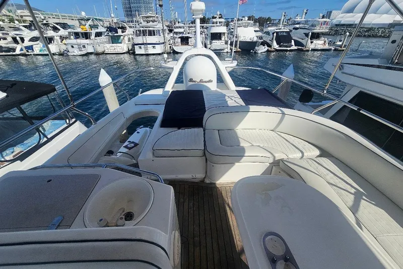 Slide: The Image of Luxurious bedroom interior of a 2000 Sealine T51 yacht with elegant wood finishes. - 24