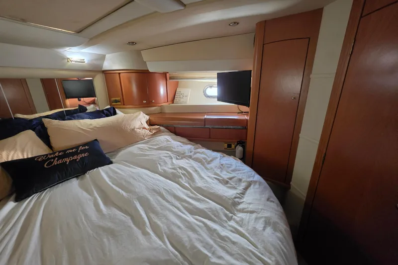 Slide: The Image of Luxurious cabin interior of 2000 Sealine T51 MY yacht with cozy bedding and wood finish. - 25