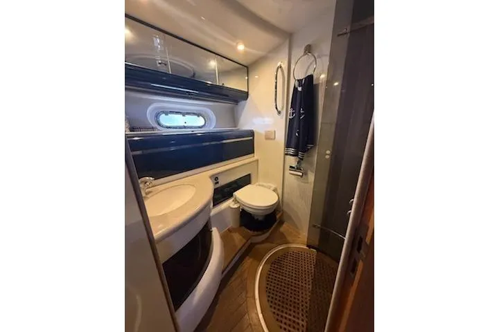 Slide: The Image of Bathroom interior of 2000 Sealine T51 yacht, featuring modern fixtures and nautical decor. - 31