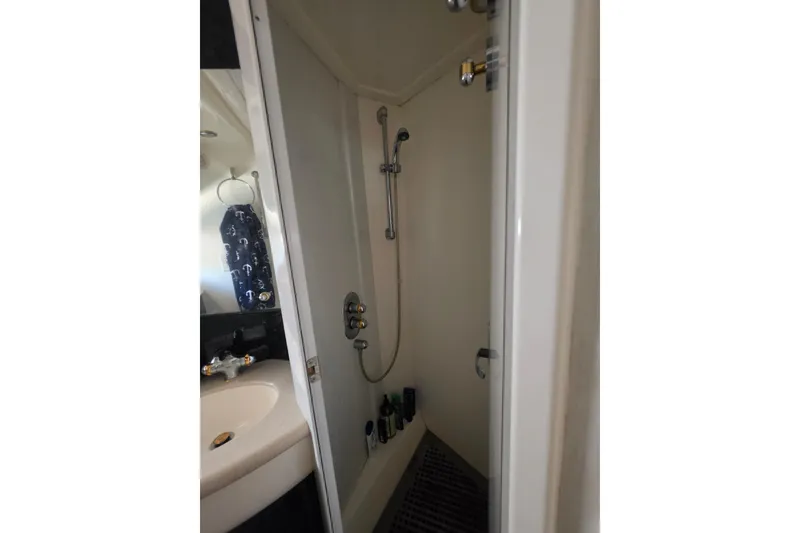Slide: The Image of Shower area in 2000 Sealine T51 MY yacht, featuring modern fixtures and compact design. - 32