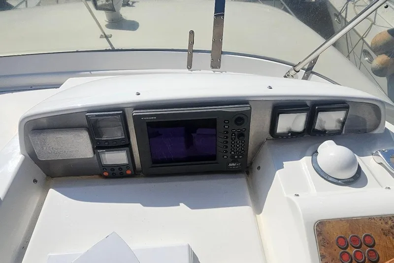 Slide: The Image of Control panel of a 2000 Sealine T51 Motor Yacht with navigation equipment. - 7