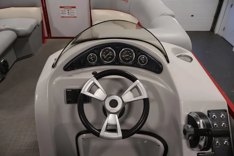 Slide: The Image of 2019 Bentley Pontoons 200 CRUISE dashboard with steering wheel and gauges. - 16