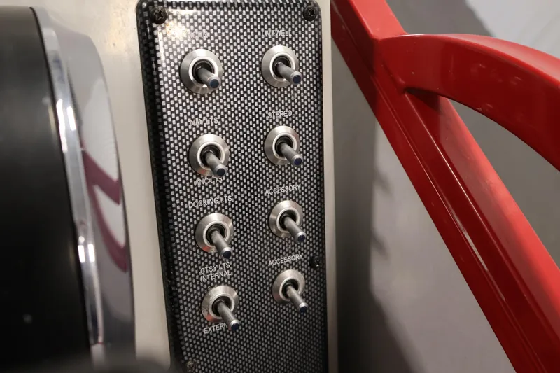 Slide: The Image of Control panel of a 2019 Bentley Pontoons 200 CRUISE with toggle switches. - 22