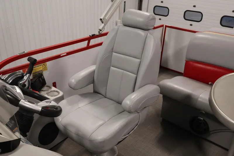 Slide: The Image of 2019 Bentley Pontoons 200 CRUISE interior with gray captain's chair and steering console. - 24