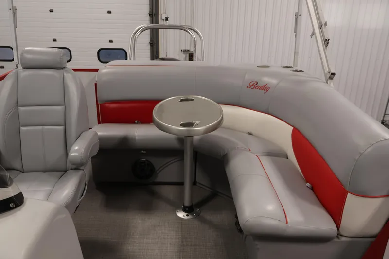 Slide: The Image of 2019 Bentley Pontoons 200 CRUISE interior with gray and red seating, round table. - 25
