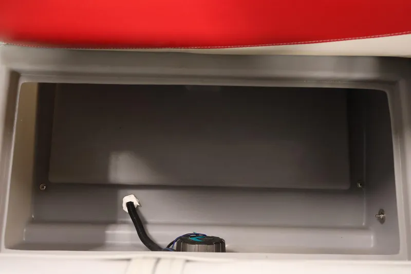 Slide: The Image of Storage compartment in a 2019 Bentley Pontoons 200 CRUISE boat, featuring red upholstery. - 27